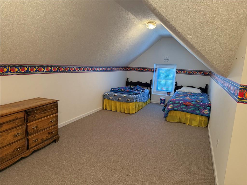 76 Remington Lane Jasper, GA 30143 - Photo 13 of 19 a bedroom with a bed and a dresser