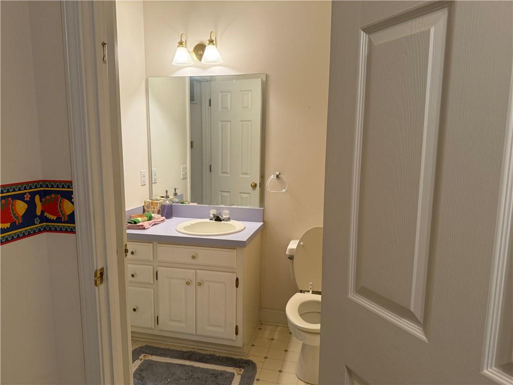76 Remington Lane Jasper, GA 30143 - Photo 16 of 19 a bathroom with a sink a toilet and a mirror