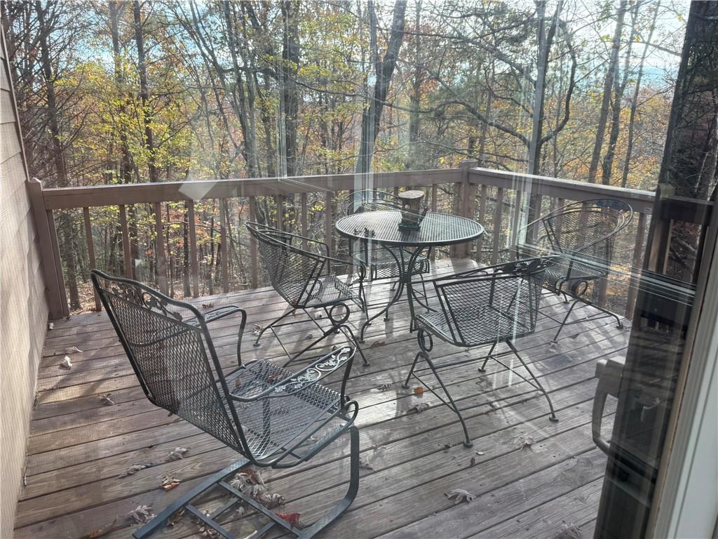 76 Remington Lane Jasper, GA 30143 - Photo 18 of 19 a view of a chairs and table on the deck