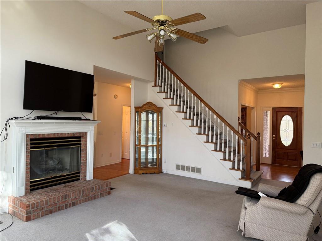 76 Remington Lane Jasper, GA 30143 - Photo 4 of 19 a view of livingroom with furniture fireplace fan and a flat screen tv