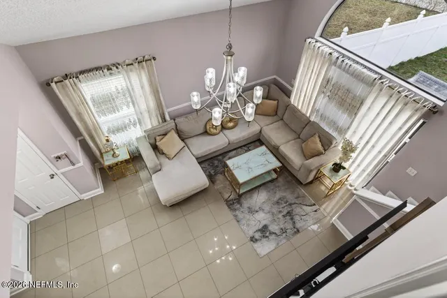 a bed room with a bed mirror and a window