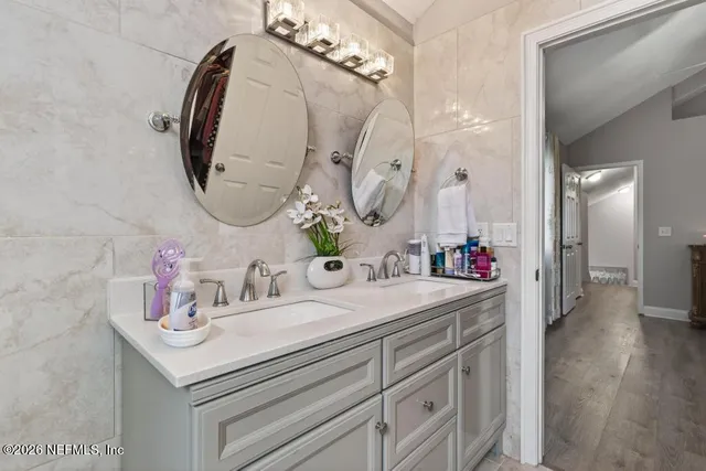 a bathroom with a bathtub and shower