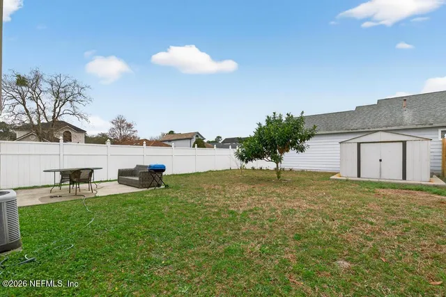 a house view with a backyard space