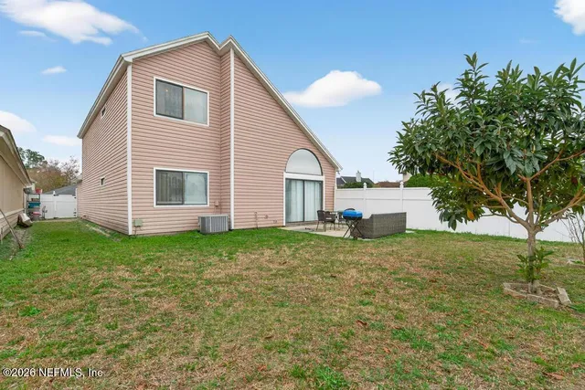 a storage room with lots of appliances and furniture