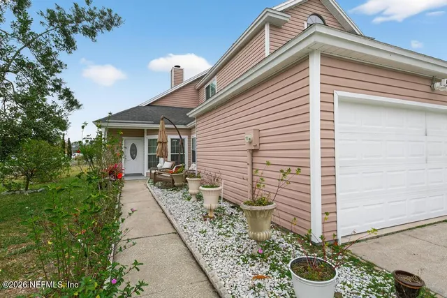 a front view of a house with garden