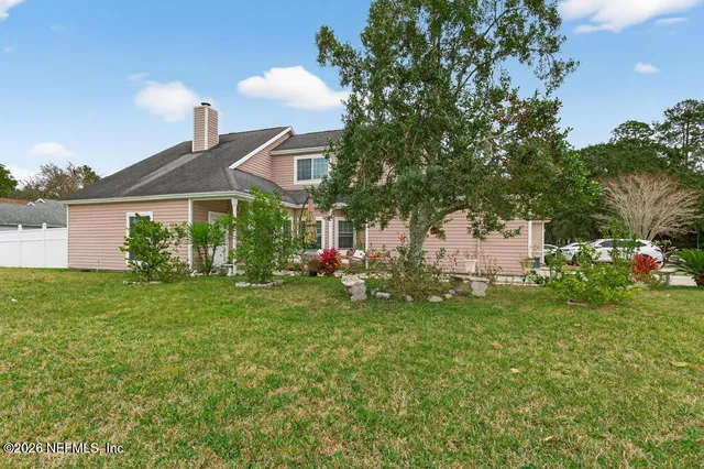 a view of a house with a park