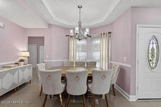 a kitchen with a refrigerator and a stove top oven
