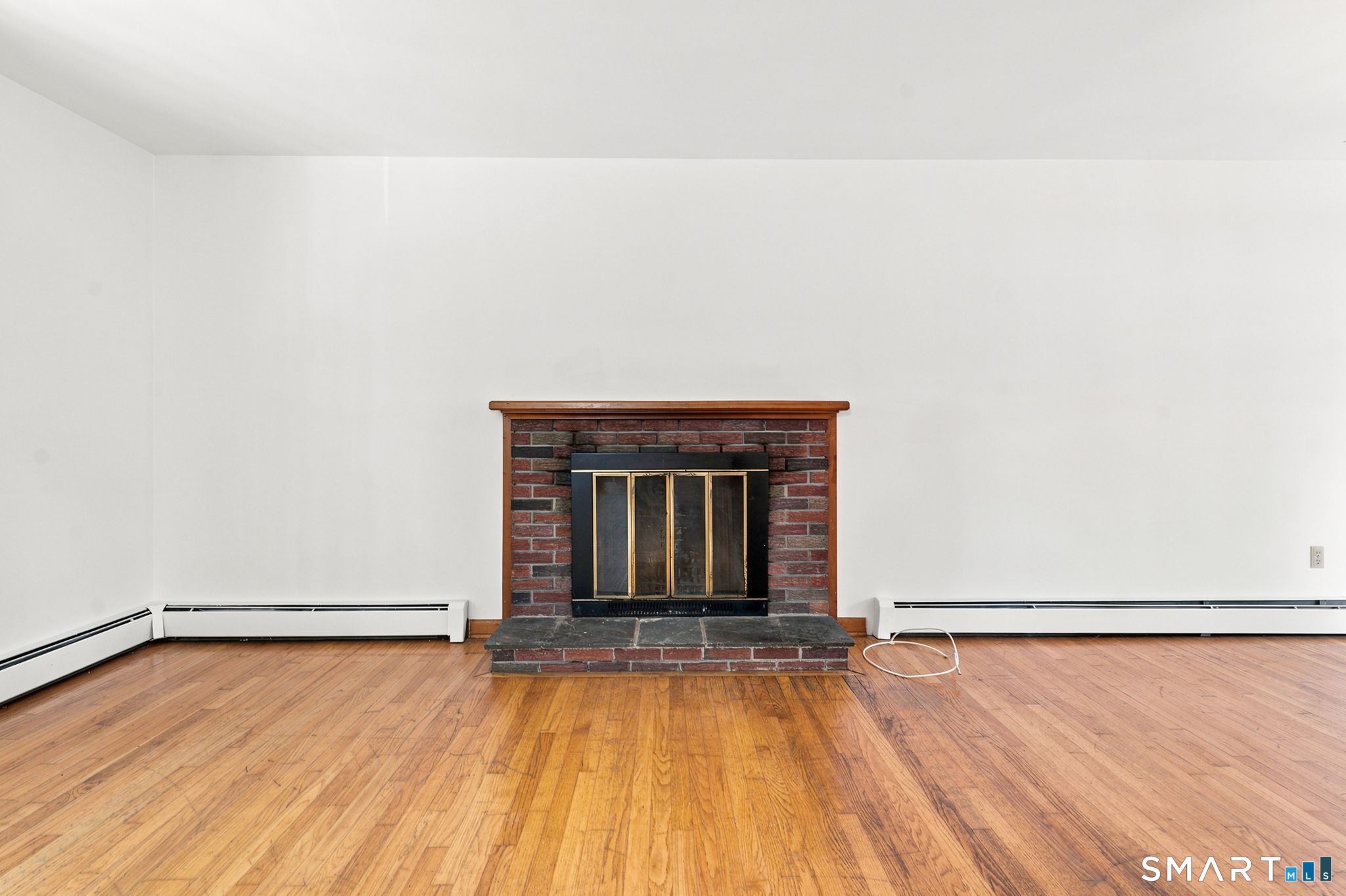 448 Mixville Road Cheshire, CT 06410 - Photo 8 of 32 a view of an empty room with wooden floor