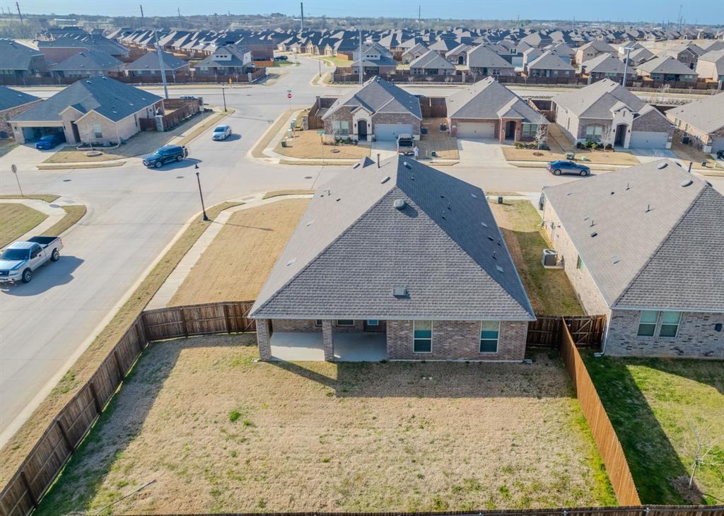 2902 Trusting Way Aubrey, TX 76227 - Photo 37 of 38 Single-story residence featuring a gray shingle roof and a brick exterior