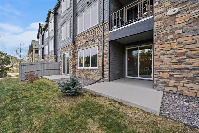 a view of a brick house with many windows