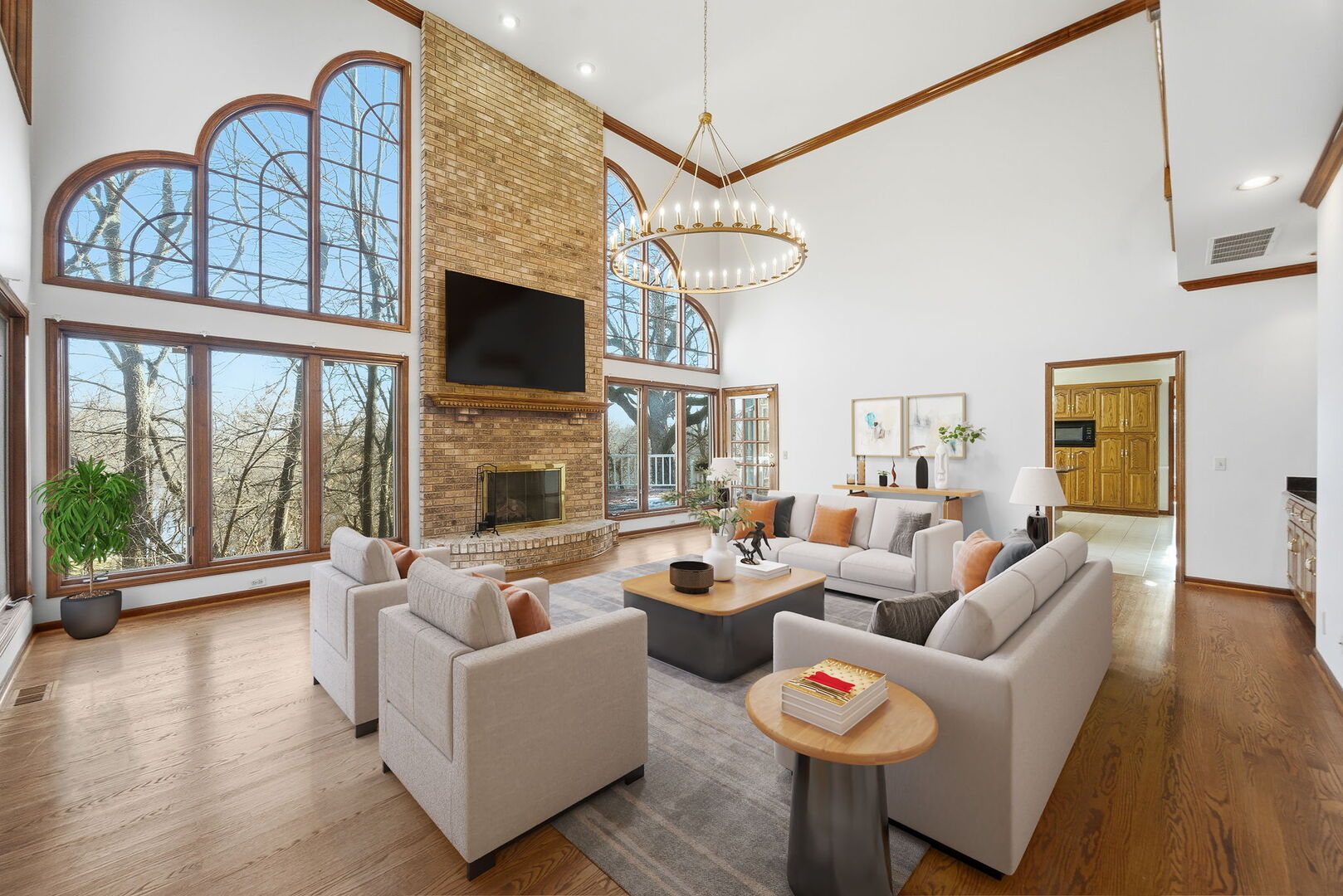 21 Canyon Court Oswego, IL 60543 - Photo 12 of 40 a living room with fireplace furniture and a flat screen tv