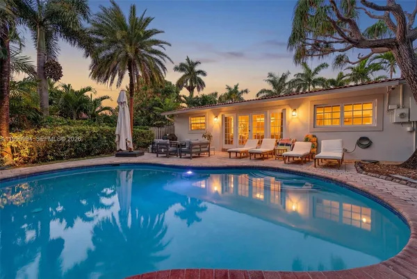 a view of a swimming pool and lounge chair