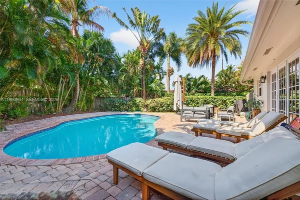 a view of a swimming pool with a patio