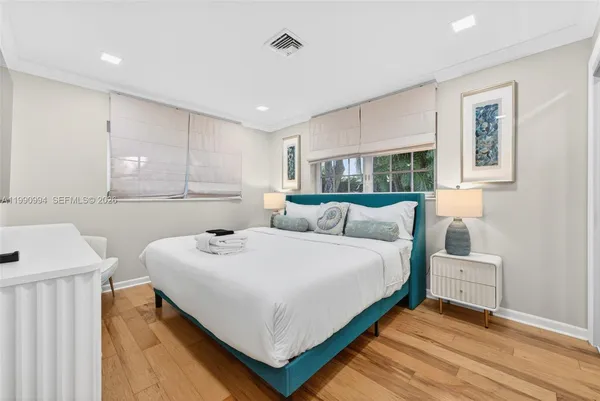 a bedroom with a bed and a table