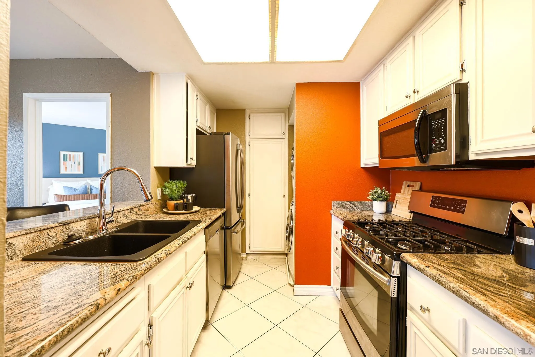 2946 Anawood Way Spring Valley, CA 91978 - Photo 20 of 45 a kitchen that has a sink and a stove