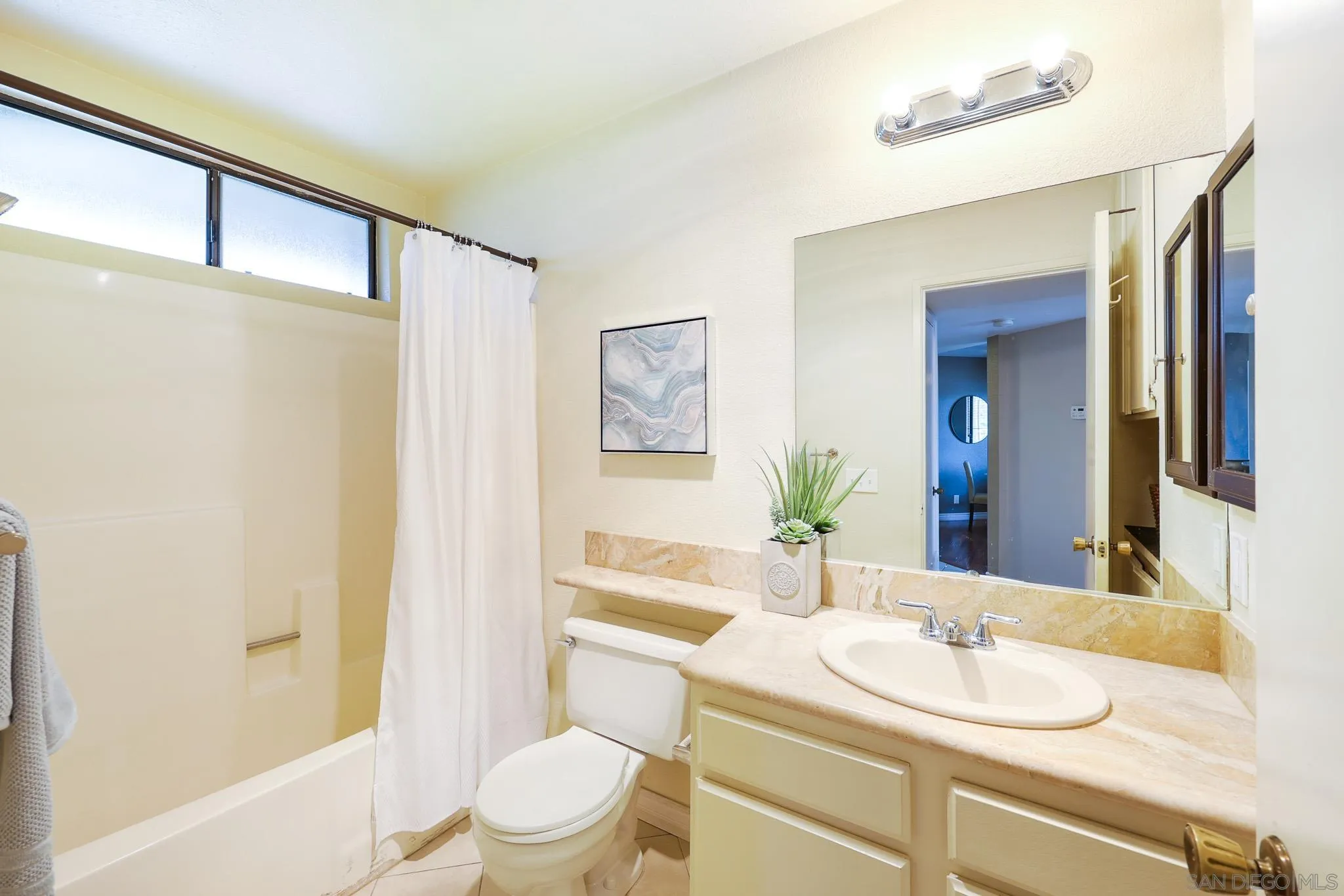 2946 Anawood Way Spring Valley, CA 91978 - Photo 33 of 45 a bathroom with a sink a toilet and shower