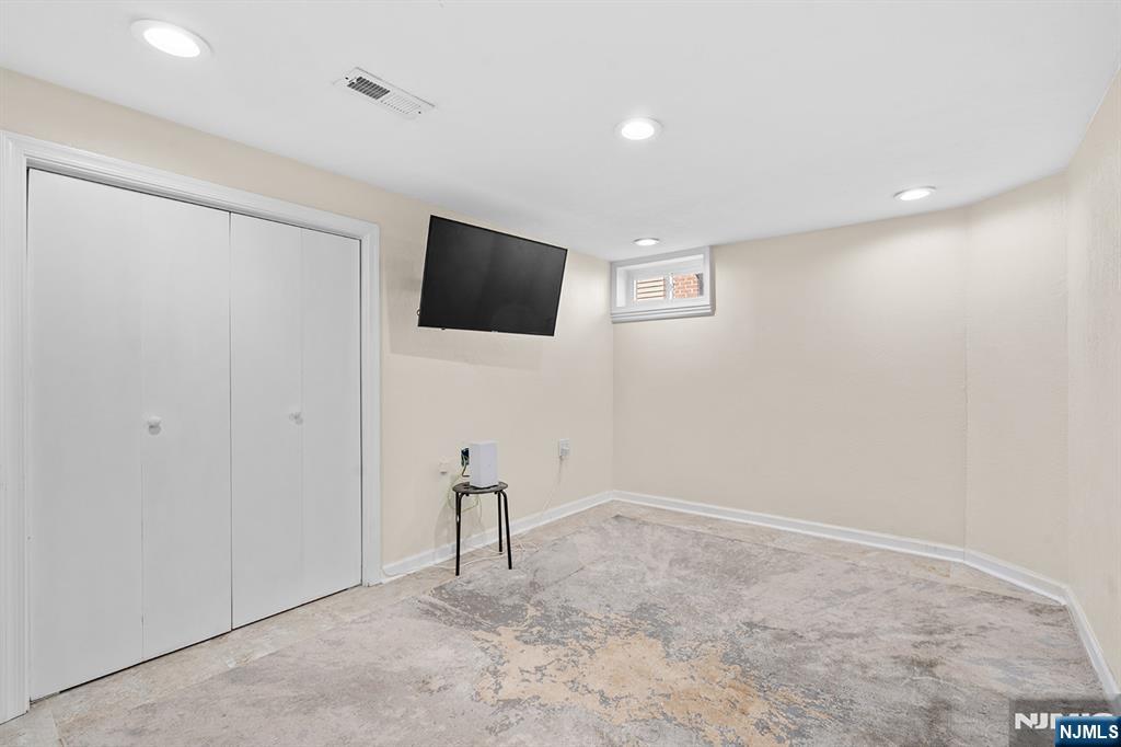 71 Wingra Avenue Rutherford, NJ 07070 - Photo 15 of 20 a view of a livingroom with a flat screen tv