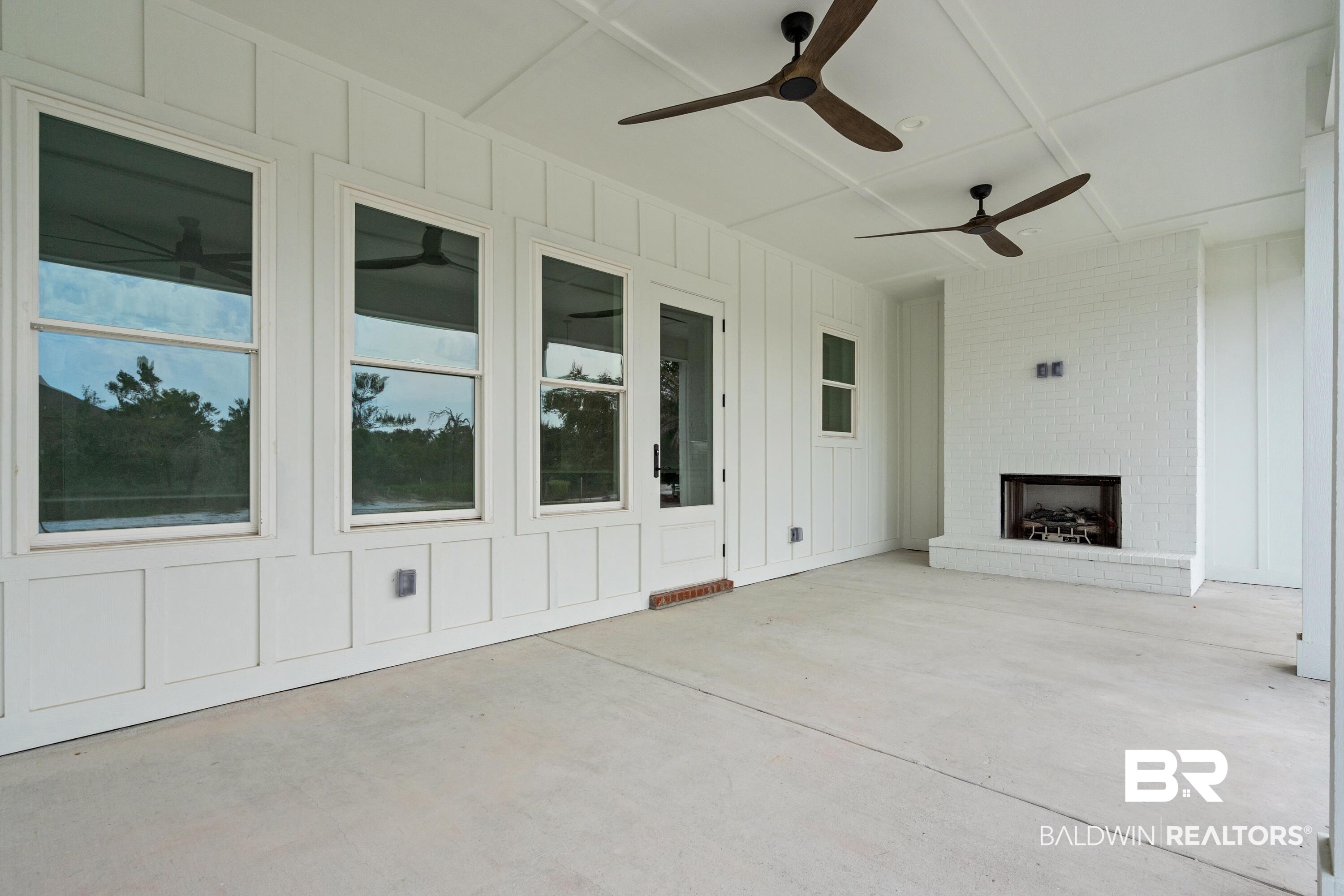 30650 Ono N Loop West Orange Beach, AL 36561 - Photo 33 of 38 View of patio / terrace with a fireplace and a ceiling fan