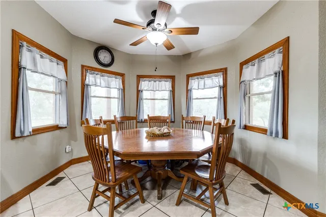 a view of a livingroom with furniture and a window
