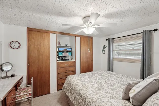 a bedroom with a bed and a dresser