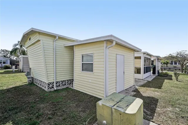a front view of house with a garden