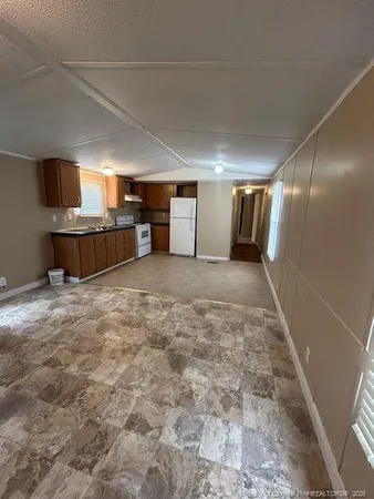 a view of a hallway with a room