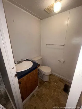 an empty room with a empty space and windows