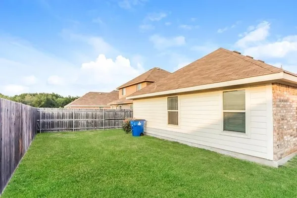 a view of a backyard with a garden and plants