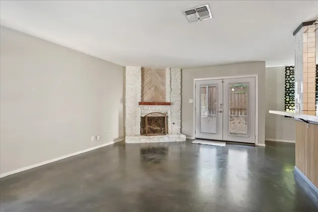 a kitchen with stainless steel appliances a refrigerator and wooden floor