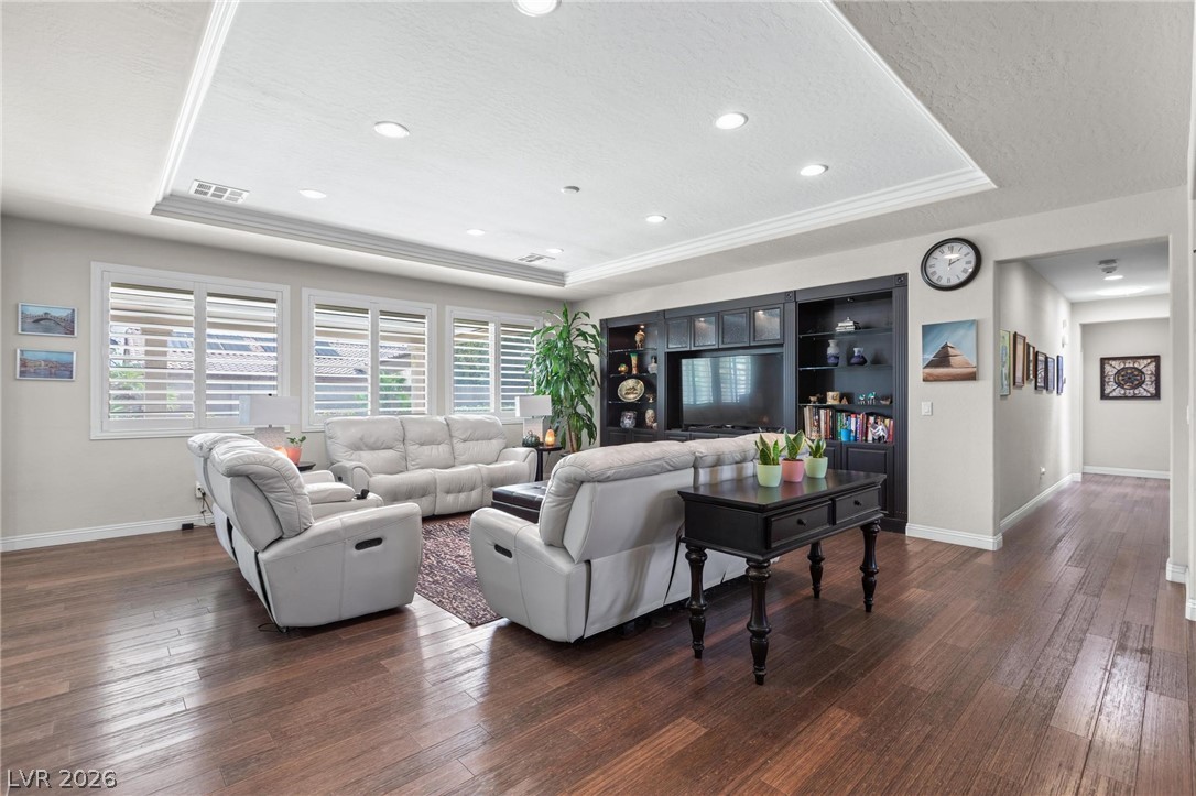 8431 Durango Ranch Court Las Vegas, NV 89113 - Photo 7 of 49 This inviting living space features rich hardwood flooring and abundant natural light.