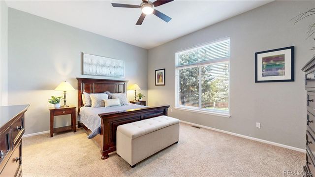 a bed room with a bed and a window