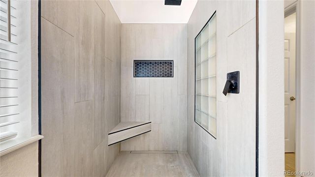 a view of a livingroom with workspace and a window