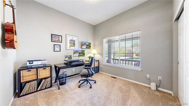 a bathroom with a sink a toilet a mirror a bathtub and shower