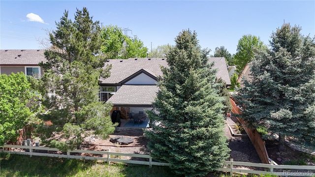 a view of a house with a yard and a pool