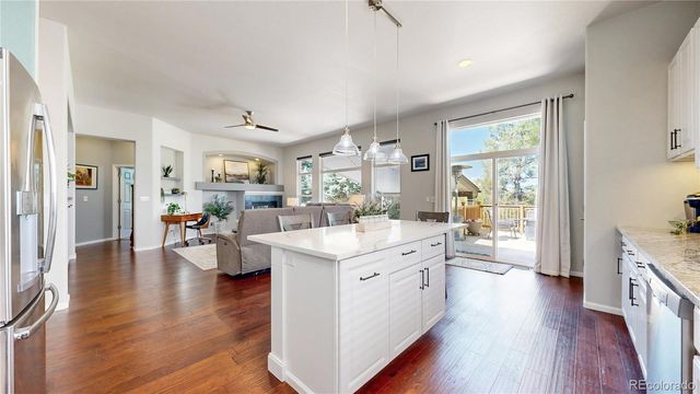 a open kitchen with sink and cabinets