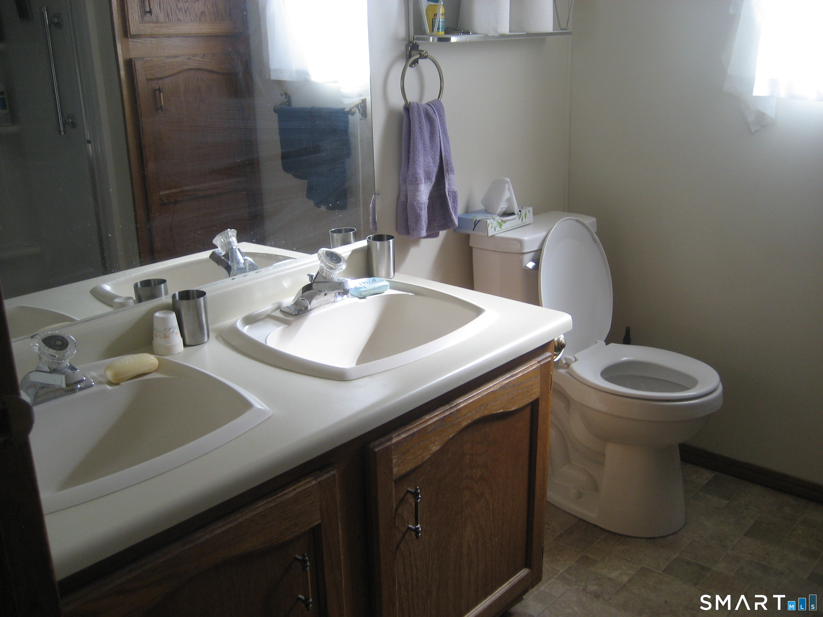 136 Hunters Road Norwich, CT 06360 - Photo 11 of 16 a bathroom with a sink and a toilet