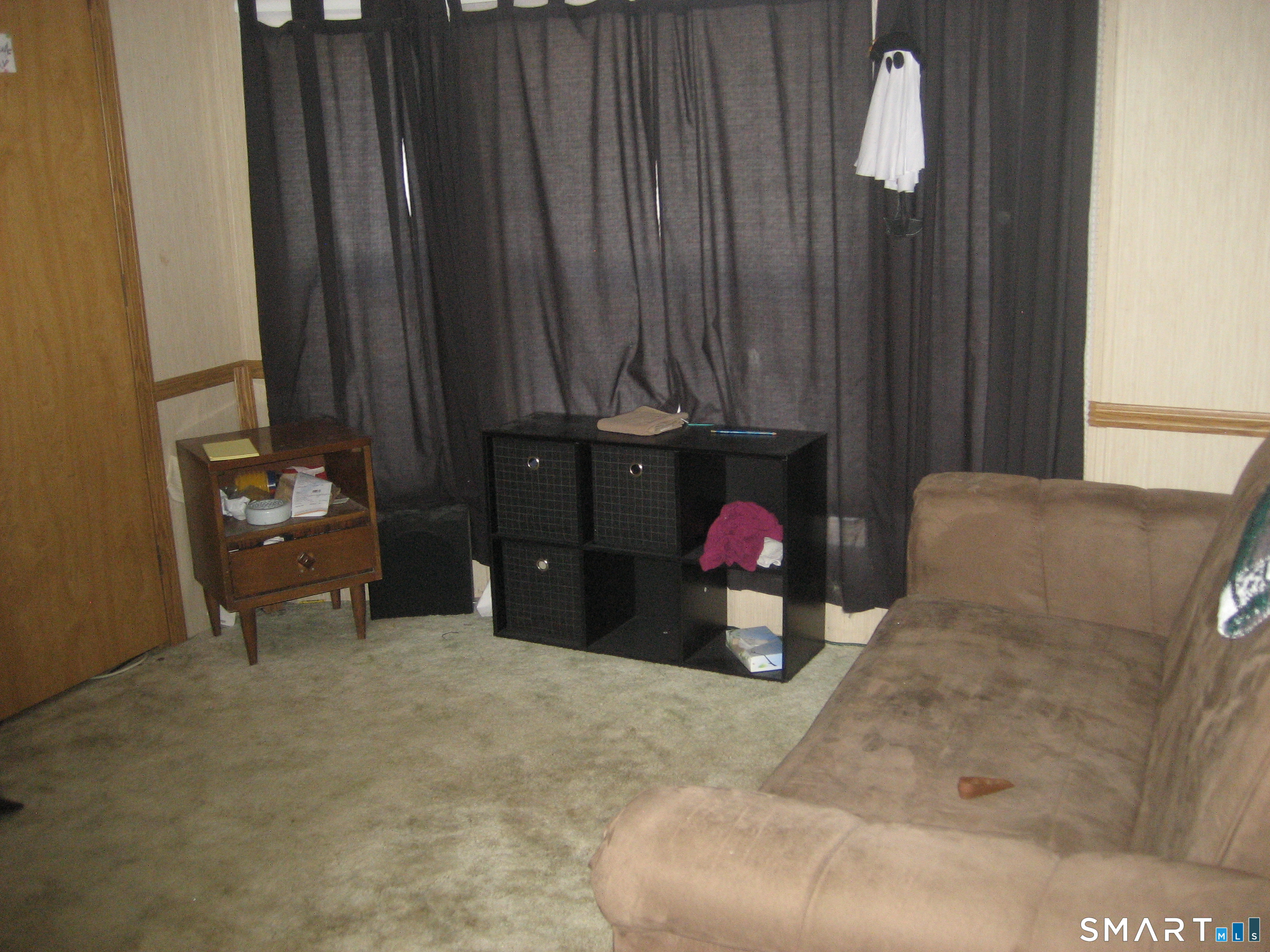 136 Hunters Road Norwich, CT 06360 - Photo 4 of 16 a living room with furniture and a fireplace