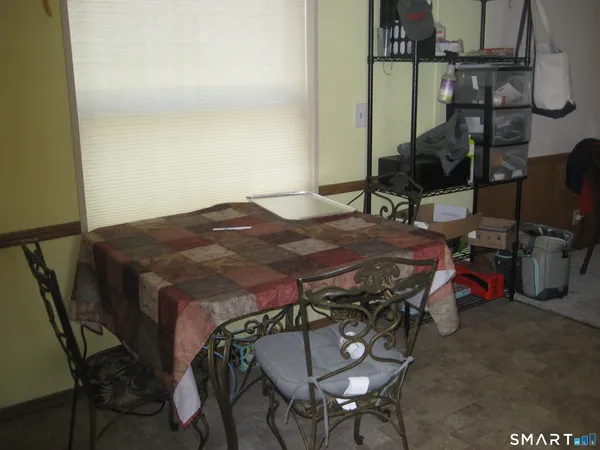 a bedroom with a bed a desk and chair