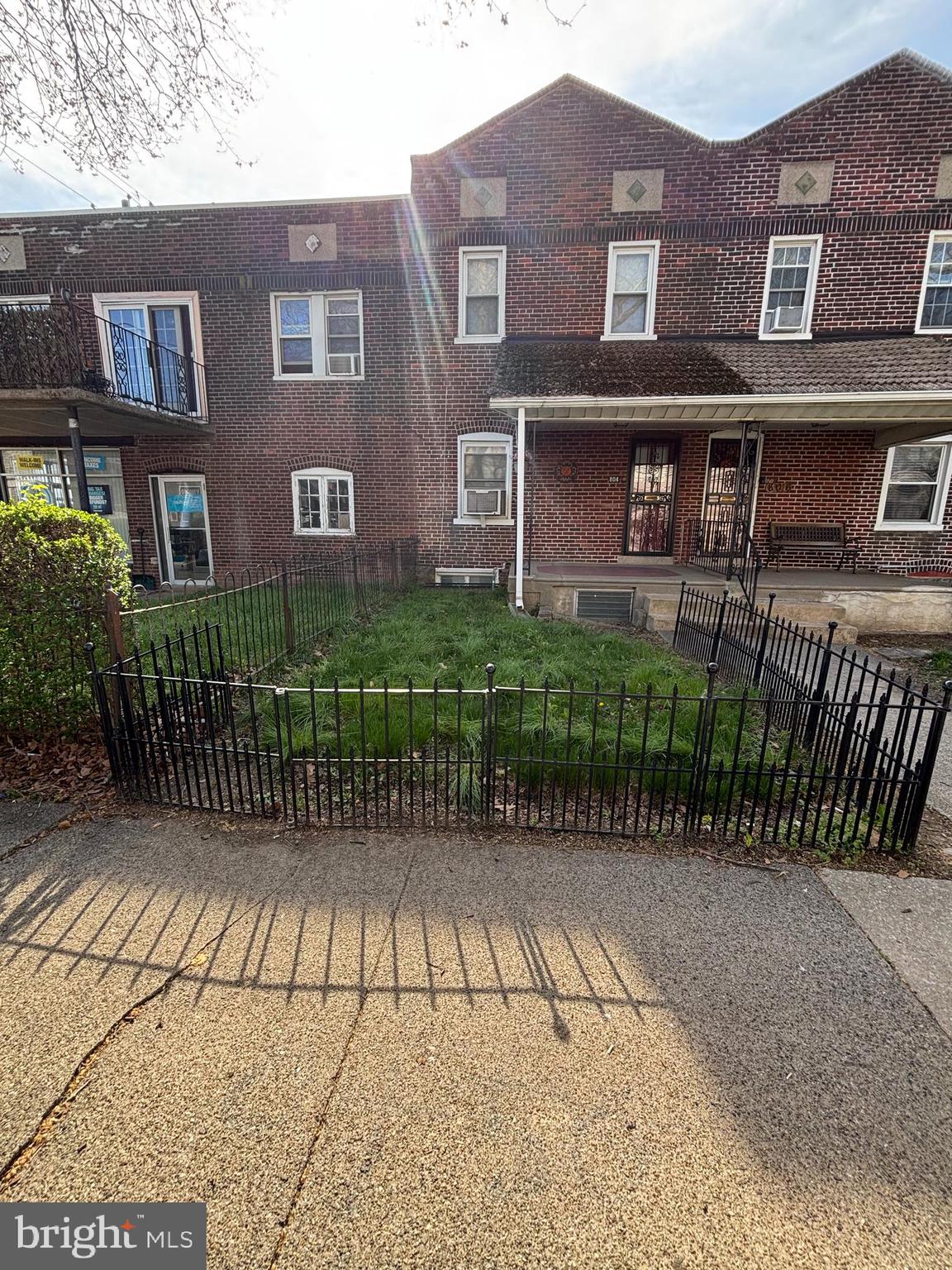 804 Kenmore Road Philadelphia, PA 19151 - Photo 1 of 28 a front view of a house with a garden