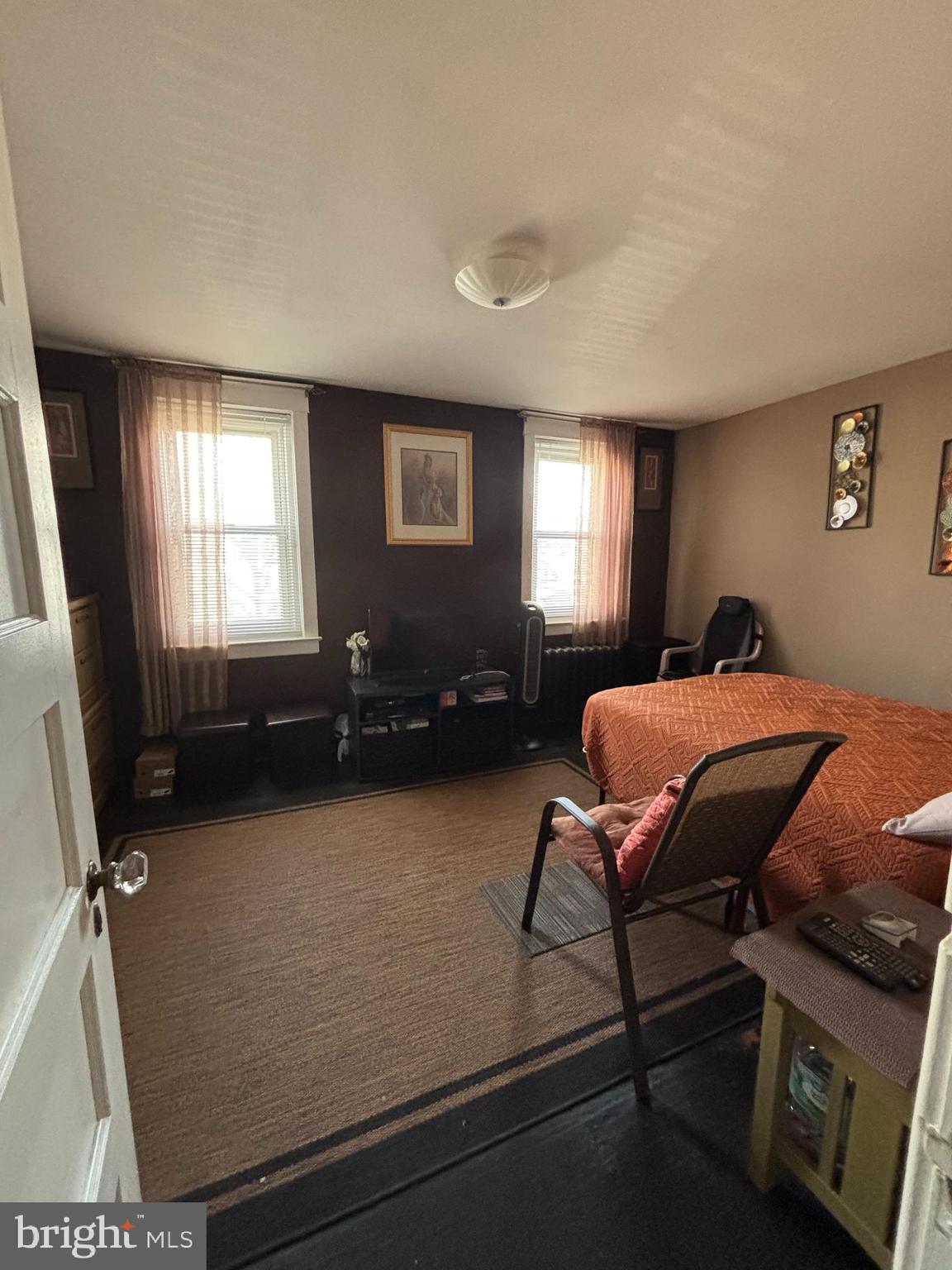 804 Kenmore Road Philadelphia, PA 19151 - Photo 14 of 28 a bedroom with a bed and wooden floor