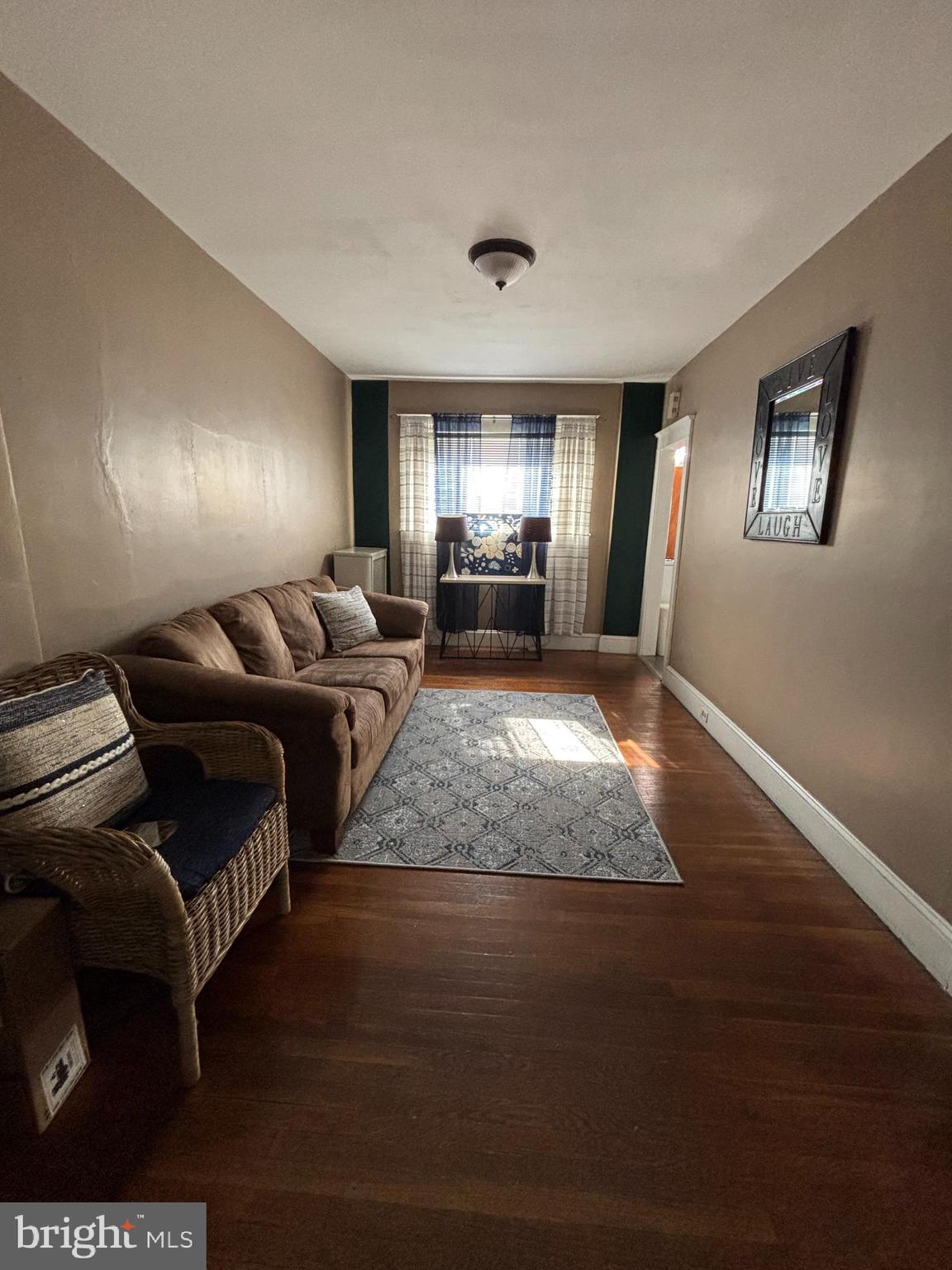 804 Kenmore Road Philadelphia, PA 19151 - Photo 7 of 28 a living room with furniture rug and window