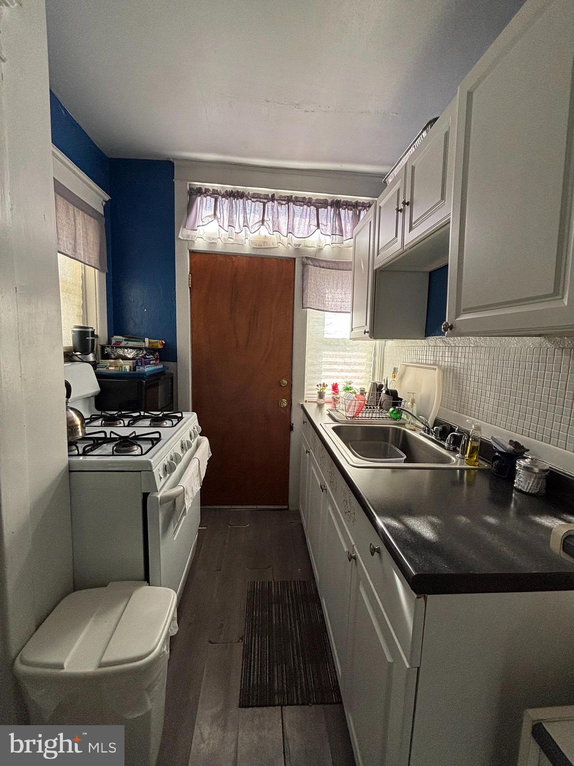 804 Kenmore Road Philadelphia, PA 19151 - Photo 10 of 28 a kitchen with a stove and a sink
