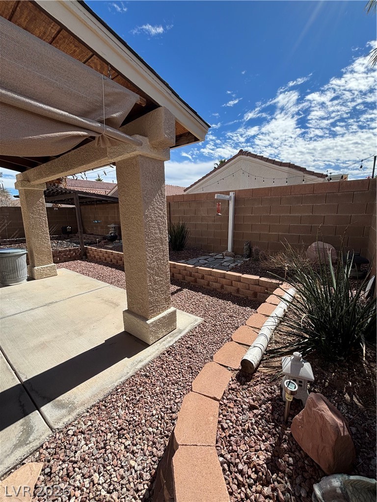 2661 Hillgrass Road Las Vegas, NV 89123 - Photo 25 of 27 Fenced backyard featuring a patio area