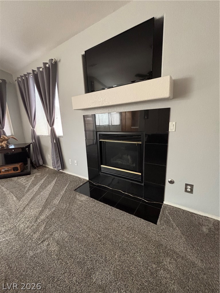 2661 Hillgrass Road Las Vegas, NV 89123 - Photo 5 of 27 Detailed view of carpet and a tile fireplace
