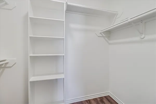 a view of an empty walk in closet
