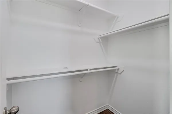 a view of an empty walk in closet