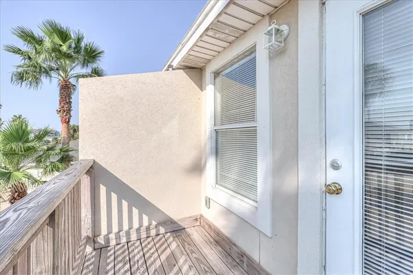 a view of balcony with wooden floor