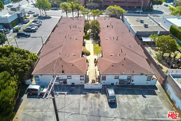 an aerial view of a house with swimming pool