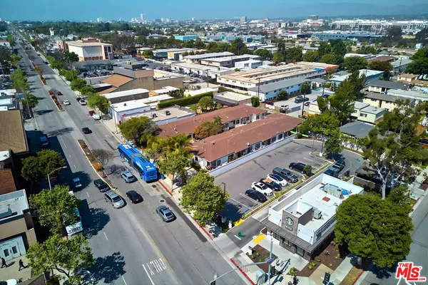 an aerial view of a multi story parking building