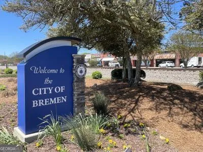a view of a brick house with many windows